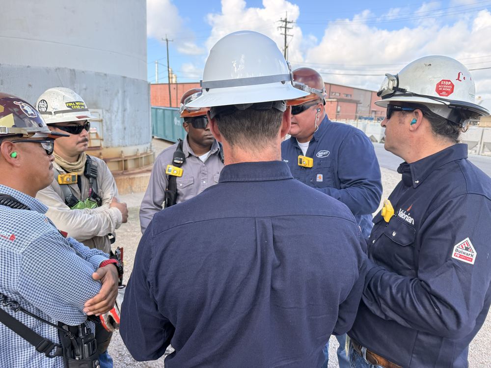 Crew members gathered for a pre-job safety discussion